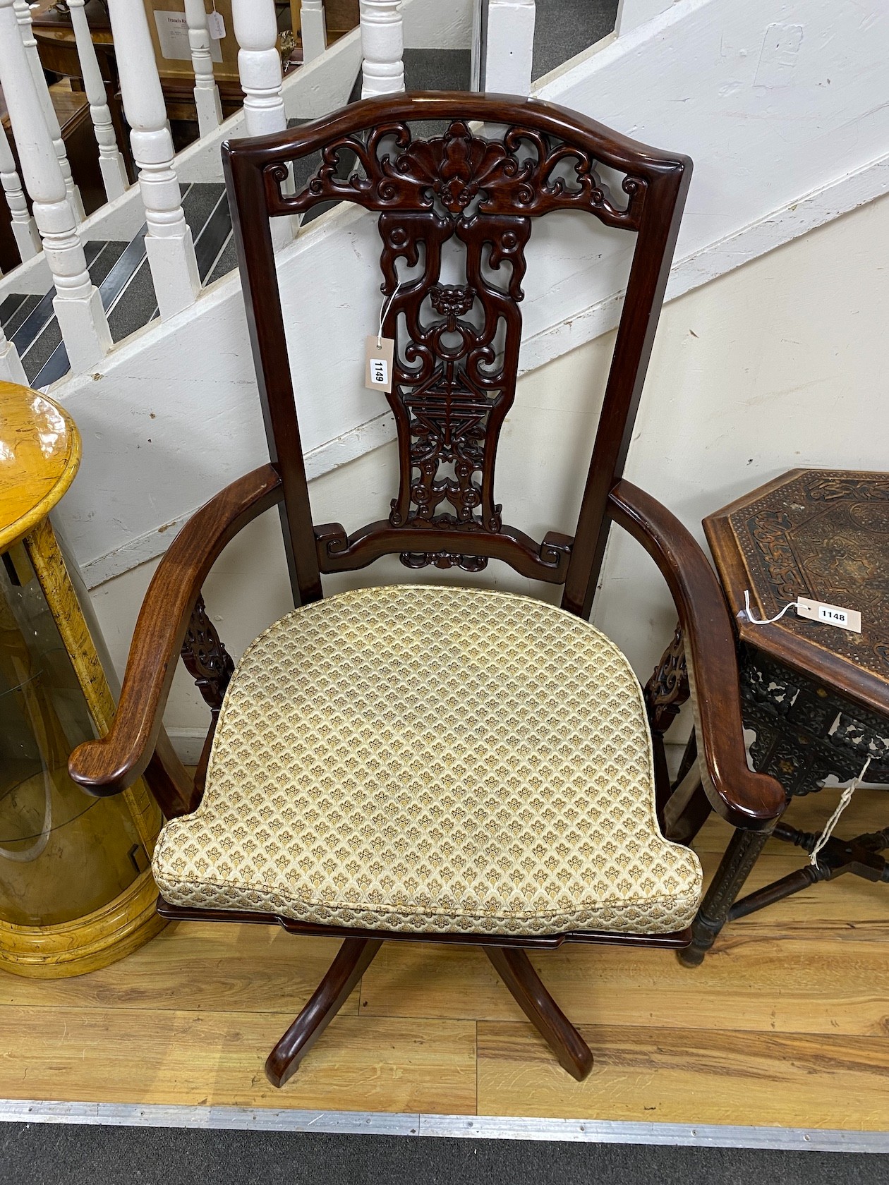 A large Chinese hardwood swivel desk chair, width 73cm